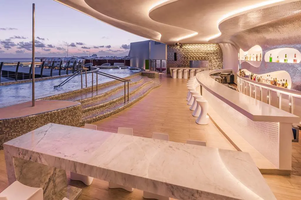 Upper-level bar and pool deck at Temptation Cancun Resort